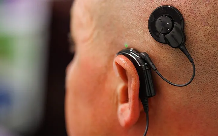 Cochlear implant processor worn behind the ear